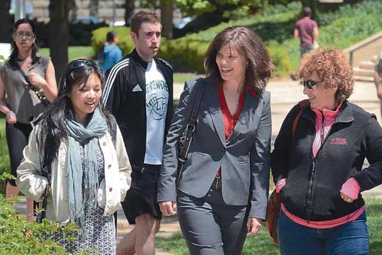Childhood Studies PhD's - the first in the nation - Lara Saguisag (left), Deborah Valentine (center), and Marla DeMesquita Wander (right) walk together to attend an end-of-the year departmental luncheon on the Rutgers–Camden campus May 3, 2013.( TOM GRALISH / Staff Photographer )