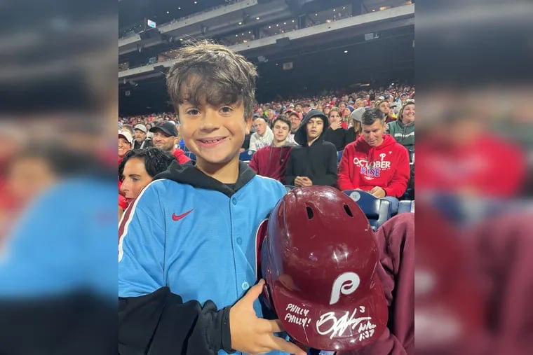 Bryce Harper was ejected and threw his helmet into the stands. Young fan Hayden Dorfman received the helmet after his dad caught it.