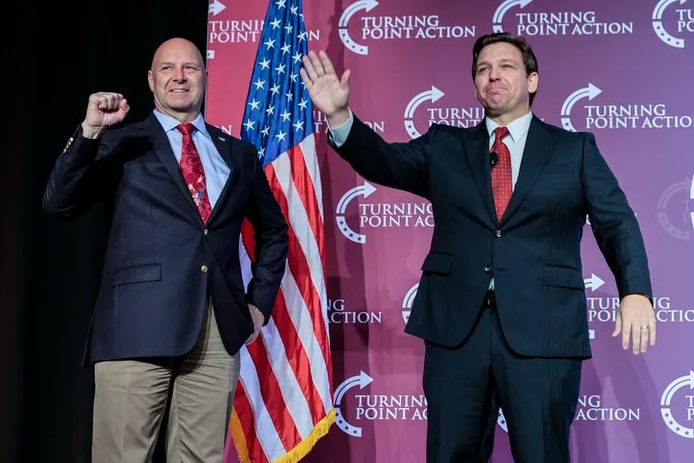 Florida Gov. Ron DeSantis (right) waves after his rally with Pennsylvania GOP gubernatorial nominee Doug Mastriano in Pittsburgh on Friday.