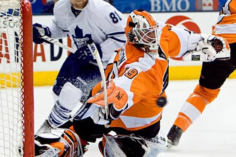 Maple Leafs center Phil Kessel (81) watches the puck get past Flyers goalie Michael Leighton. (Frank Gunn / AP Photo, The Canadian Press)