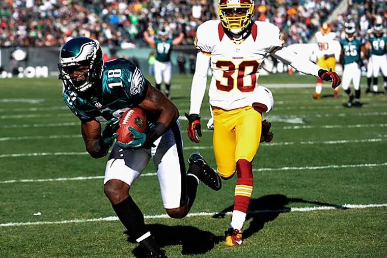 The Eagles' Jeremy Maclin, left, pulls in a touchdown pass
against the Redskins' D.J. Johnson. (AP Photo/Michael Perez)