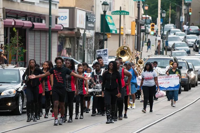Members of the Finest Drill Team and Drum Corps walk down Germantown Avenue for the Juneteenth Parade in Philadelphia on Saturday, June 20, 2015. (MICHAEL PRONZATO/Staff Photographer)