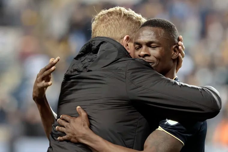 Union manager Jim Curtin and veteran striker Cory Burke embracing after the final whistle of the 3-1 win over NYCFC on Sunday night.