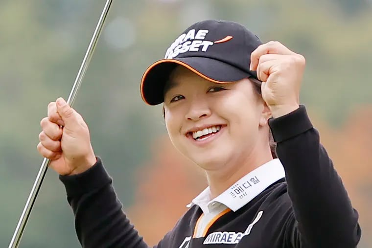 Sei Young Kim raises her arms on the 18th hole after winning the 2020 KPMG Women’s PGA Championship at Aronimink Golf Club in Newtown Square, Pa. on October 11, 2020.