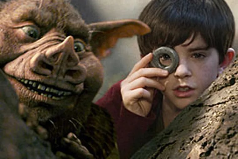 Hogsqueal (voiced by Seth Rogen) helps Jared Grace (played by Freddie Highmore) spy on the wicked creatures in "The
Spiderwick Chronicles."