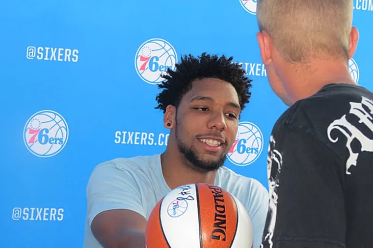 Jahlil Okafor signing an autograph for a fan at the Sixers Beach Bash
on Aug. 1, 2015.