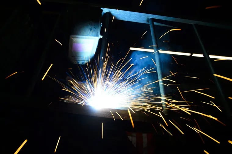 A welder fabricates a steel structure at an iron works facility in Ottawa, Ontario, Monday, March 5, 2018. President Donald Trump’s plan to impose stiff tariffs on imported steel and aluminum would be ruinous for the world economy, Moodys economist Mark Zandi argues.