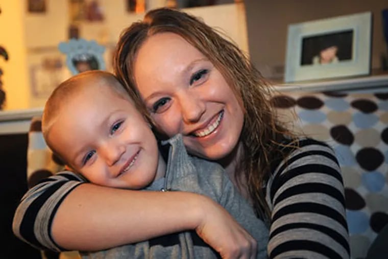 Three-year-old Jaden Bolli of Maple Shade saved his grandmom's life when he dialed 911. He is with his proud mom Candace Robbins in their Maple Shade home. ( Sharon Gekoski-Kimmel / Staff Photographer )