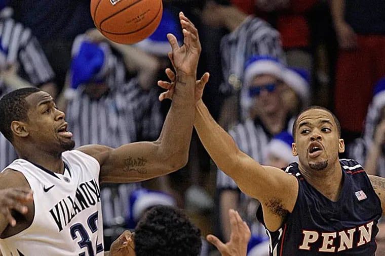 Villanova's James Bell and Penn's Henry Brooks and Tony Bagtas go after a rebound. (Laurence Kesterson/AP)