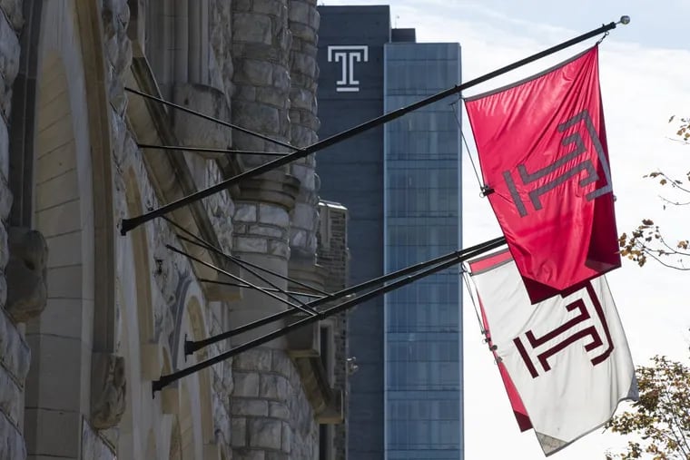 Flags wave in the wind from a building on the Temple University campus in Philadelphia, Tuesday, Oct. 10, 2017.