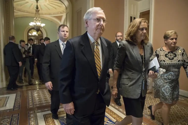 Senate Majority Leader Mitch McConnell, (R-Ky.), heads to a meeting last week at the Capitol with Treasury Secretary Steven Mnuchin, Trump’s top economic adviser Gary Cohn, and members of the Senate Budget Committee as they struggle with a tax code overhaul that will add to the deficit even as they work on a tax plan.