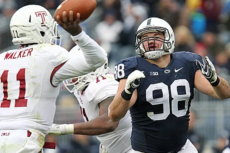 Penn State defensive tackle Anthony Zettel pressures Temple quarterback P.J. Walker. (Matthew O'Haren/USA Today Sports)