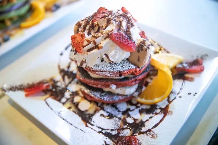 Whether you're craving sweet pancakes piled high with toppings (like the red velvet pancakes from Cafe la Maude shown here), or tangy, dinner-ready scallion pancakes, there's a restaurant with your preferred pancake style in Philly.