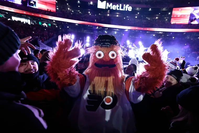Gritty dances to the Jonas Brothers before the Flyers face the New Jersey Devils during the NHL Stadium Series at MetLife Stadium in East Rutherford, N.J.