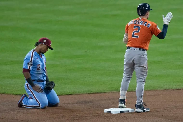 Jean Segura (left) and the Phillies put on a show, but Alex Bregman and the Astros are one win away from winning the World Series.
