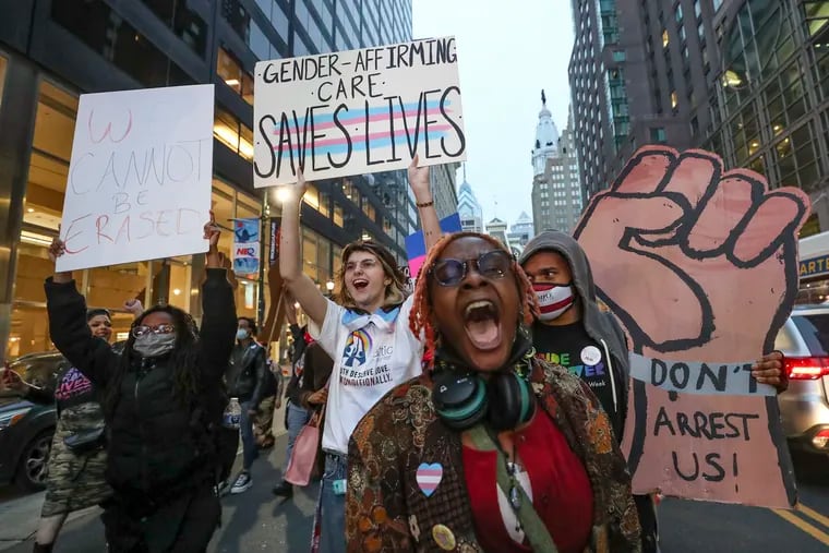 Protesters march down Market Street in Philadelphia on Friday in celebration of Trans Day of Visibility.
