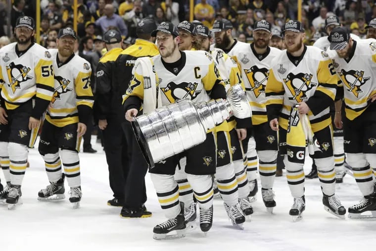 Pittsburgh Penguins’ Sidney Crosby (87) celebrates with the Stanley Cup after defeating the Nashville Predators in Game 6 of the NHL hockey Stanley Cup Final, Sunday, June 11, 2017, in Nashville, Tenn. (AP Photo/Mark Humphrey)