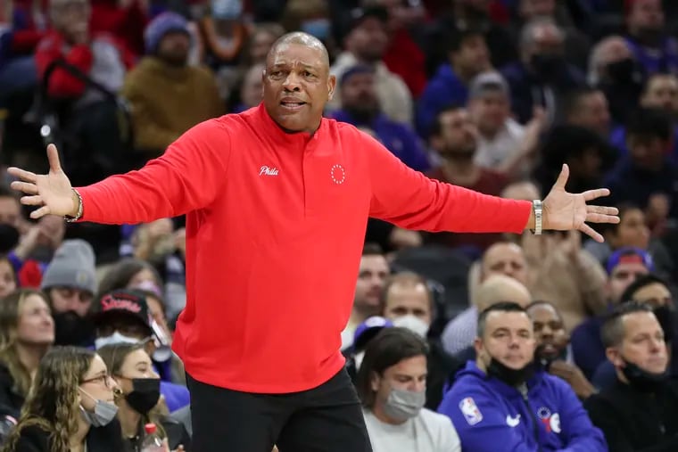 Sixers coach Doc Rivers raises his arms against the Utah Jazz on Thursday.