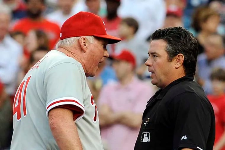 MLB umpire Rob Drake, seen here arguing with former Phillies manager Charlie Manuel  back in 2012, could be in hot water over a since-deleted pro-Donald Trump tweet claiming he'd take up arms if the president is impeached. (AP Photo/Richard Lipski)