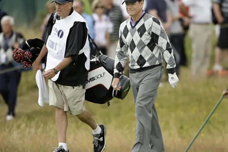 Tom Watson of the US, right, and his caddie Neil Oxman, left, walk on the 14th fairway during the opening round of the British Open Golf championship, at the Turnberry golf course, Scotland, this week. (AP Photo / Alastair Grant)