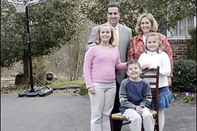 Laura and Brian Cooper, with their children Emily (left), Christopher and Gabrielle.
