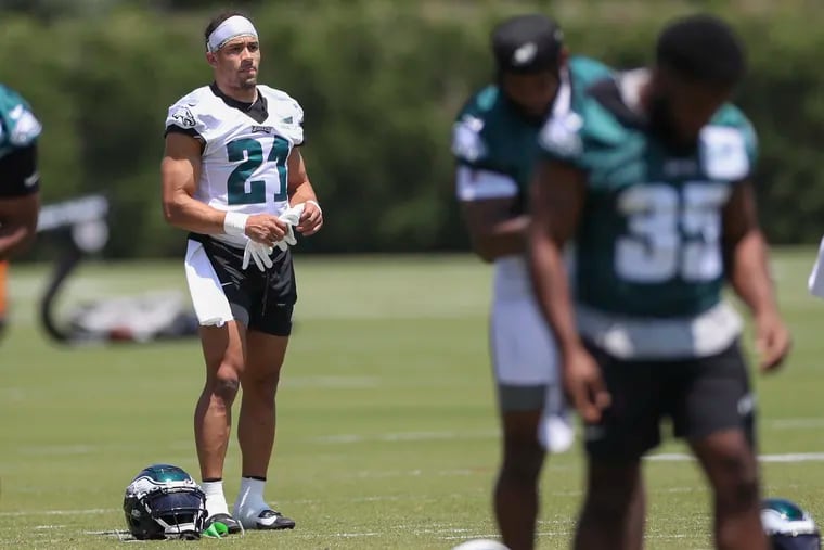 Eagles’ safety Sydney Brown stretches during OTAs at the NovaCare Complex on Thursday.