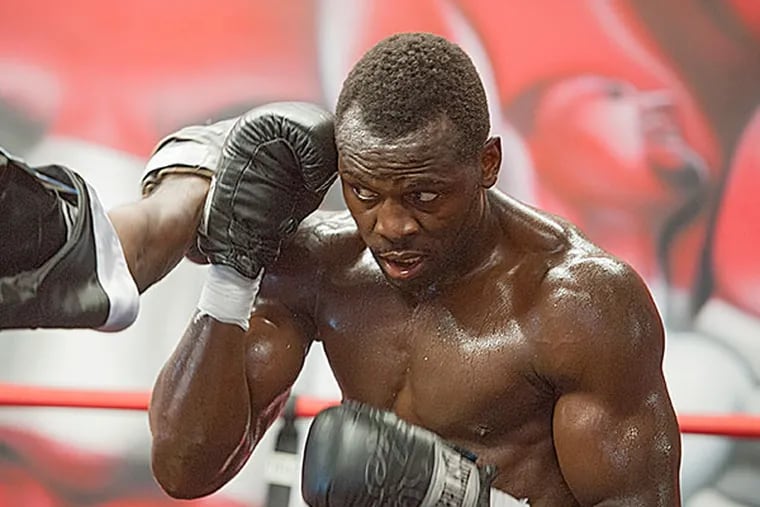 Philadelphia heavyweight boxer Steve Cunningham slips a punch during a work out in the ring at DSG Boxing Gym in Philadelphia July 22, 2015. He is training for an upcoming fight against Antonio Tarver August 14th in Brooklyn.