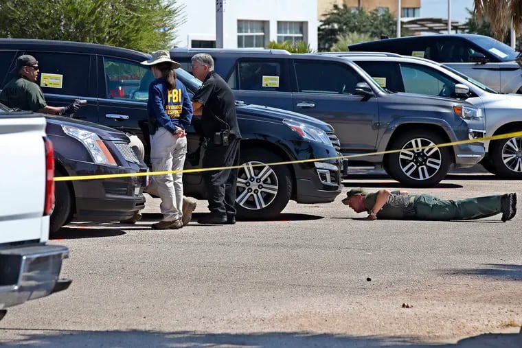 Officials continue to work the scene, Monday, Sept. 2, 2019, in Odessa, Texas, where teenager Leilah Hernandez was fatally shot at a car dealership during Saturday's shooting rampage.