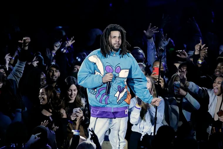 Rapper J. Cole performs at halftime during the NBA All-Star Game in Charlotte, N.C., in 2019.
