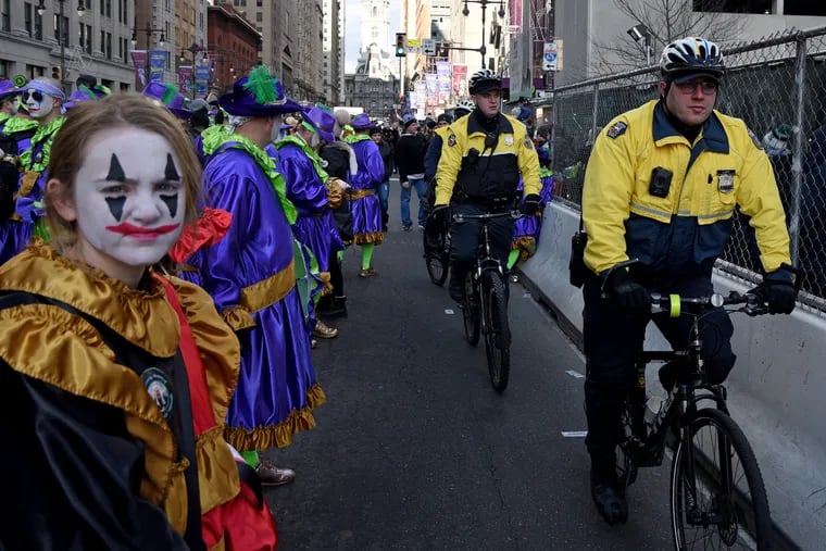 Philadelphia Police Department bicycle officers move south on South Broad Street during the annual New Year's Day Mummers Parade on Jan. 1, 2020. City government is not the the only local institution complicit in bad behavior from Mummers, writes Camari Ellis.