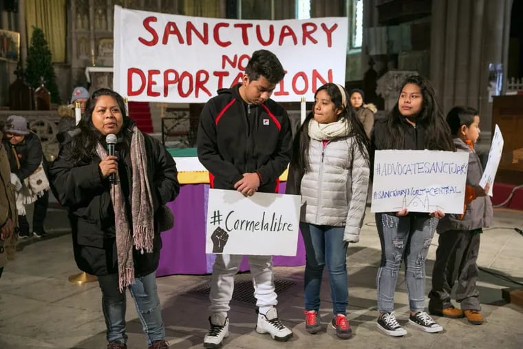 Carmela Apolonio Hernandez an undocumented worker from Mexico, and her four children addresses media and supporters during a press conference at the Church of the Advocate on the 1800 block of W. Diamond St. in Philadelphia on Wednesday, December 13, 2017. She and her children are taking sanctuary in the church to avoid deportation.