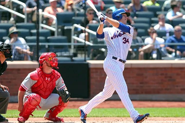 New York Mets starting pitcher Noah Syndergaard (34) hits a solo home run against the Phillies during the fourth inning at Citi Field. (Brad Penner/USA Today)