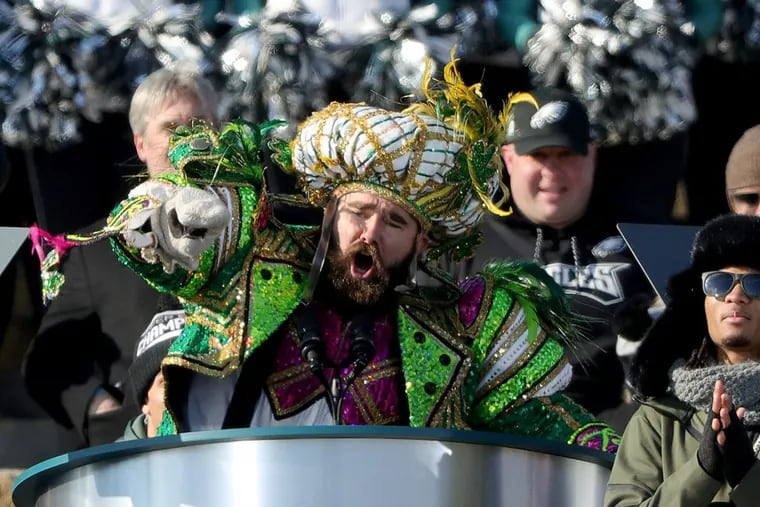 Dressed in Mummers attire, Eagles center Jason Kelce pauses during his colorful speech on the Art Museum steps.