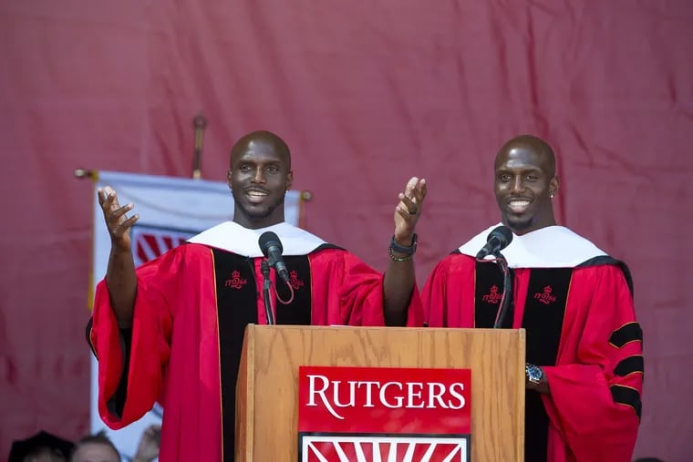 Jason McCourty (left) and Devin McCourty, Rutgers graduates and members of the New England Patriots Super Bowl championship team, speak at the university's commencement in New Brunswick.