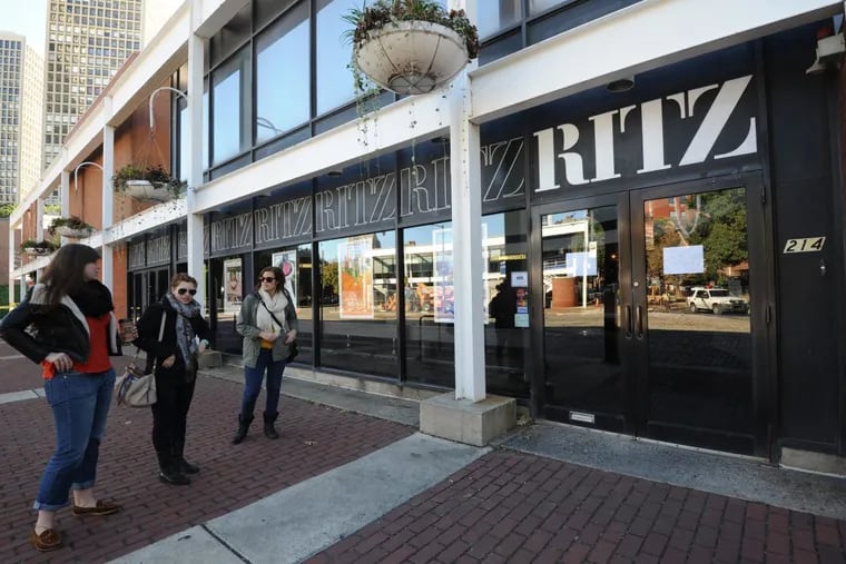 Moviegoers wait outside the Ritz 5 theaters in Old City, located at a Walnut Street site developer Tom Scannapieco sees as ideal for a new high-rise condo project in Philadelphia.