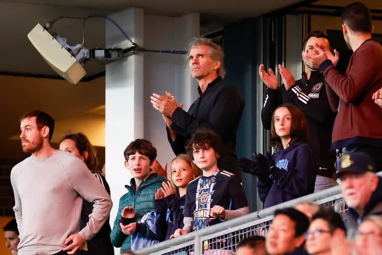 Union principal owner Jay Sugarman (center) in his suite at a recent game.