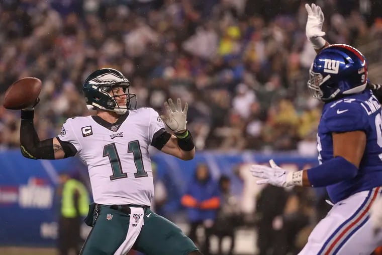 Eagles quarterback Carson Wentz throws for a touchdown to Eagles tight end Josh Perkins in the second quarter.