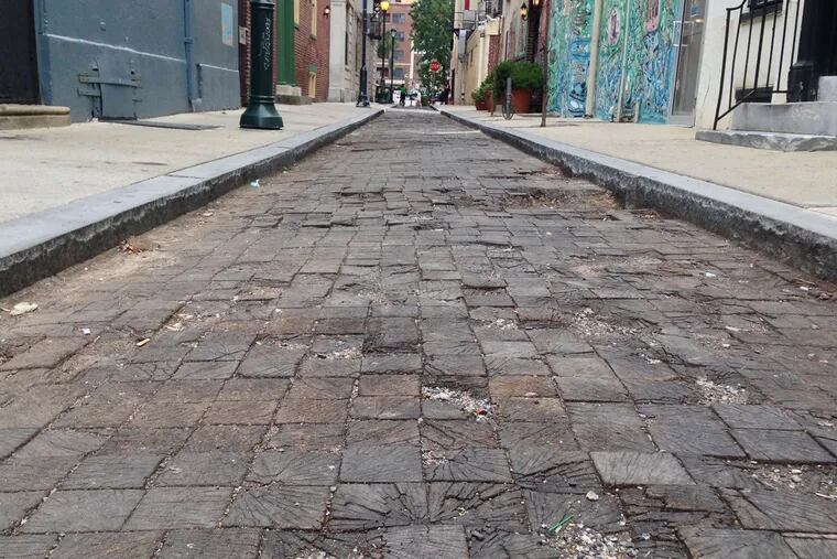 Wooden pavers on the 200 block of Camac Street rotted after a 2012 reconstruction. They've been covered with asphalt and are scheduled to be restored in 2016.