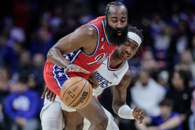 James Harden drives as the Clippers' Terance Mann defends during the second quarter on Friday.