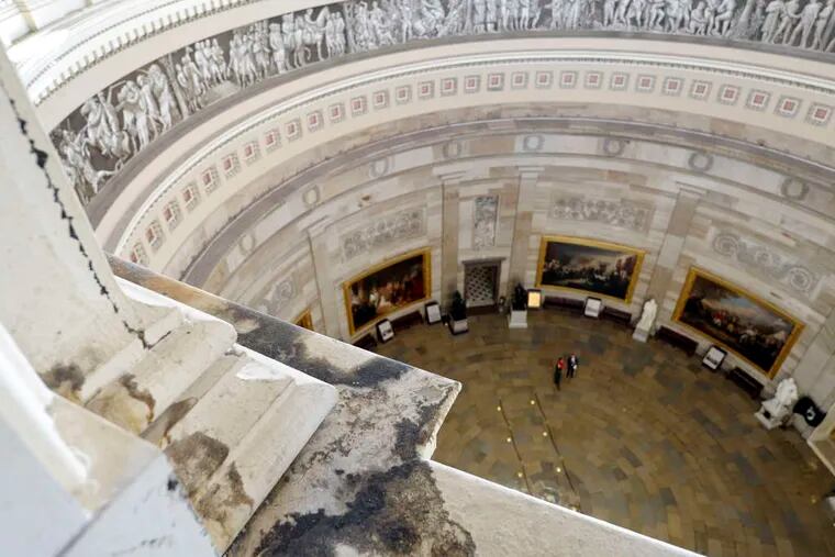 Water damage is visible inside the Capitol Dome. While the $59.5 million repair project is underway, the building will be ringed by lighted scaffolding.