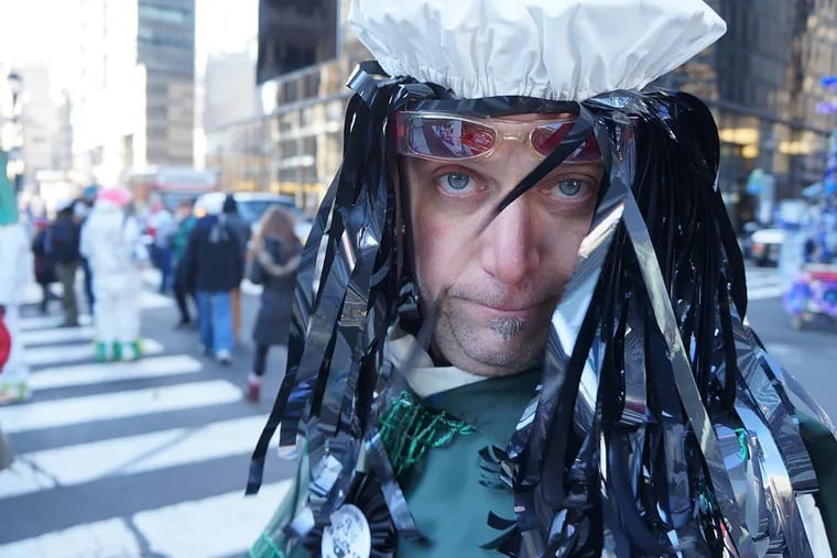 Kurt Wunder marching with the Rabble Rousers comics in a Mummers Parade.