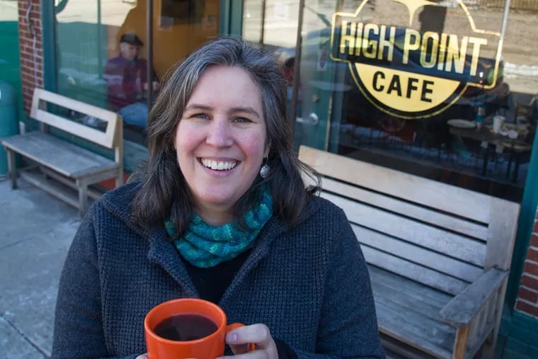 Meg Hagele realized that her passion was in coffee. Here, she is outside her High Point Cafe on Carpenter Lane. (CLEM MURRAY / Staff Photographer)