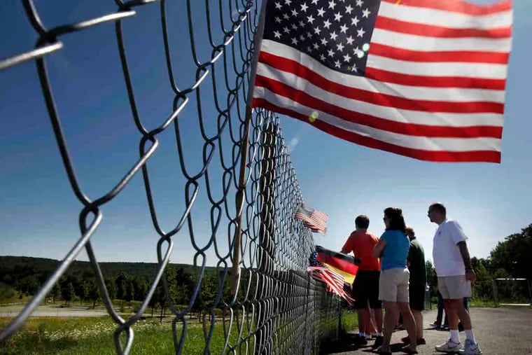 Early visitors view the crash site in Shanksville, Pa. Vice President Biden will dedicate the memorial Sept. 10. President Obama will speak the next day.