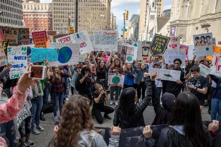 Students from around the Philadelphia region along with people of all ages come together in front of City Hall to take part in a global climate strike on Friday afternoon, March 15, 2019. Philadelphia has the momentum to declare a Climate Emergency, writes Tiara Campbell with the Climate Mobilization project.