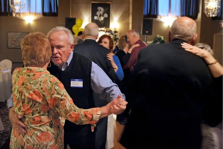 Harriet Shikes (left) of Blackwood and Tom Cussck (right) of Mt. Laurel join others with Fabulous 50s on the dance floor May 18, 2016. The group of older South Jersey single adults - who are not about dating - have been gathering for 16 years now and partied to celebrate at Touch of Class caterers in Delran.