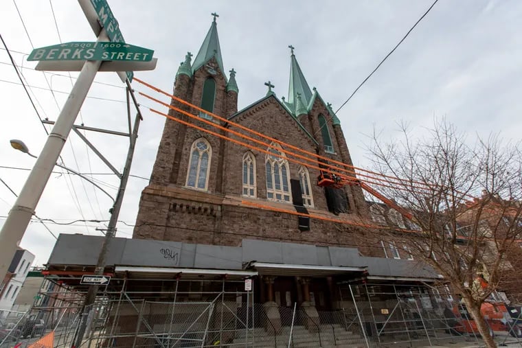 This photo from January 2019 shows a facade being repaired at St. Laurentius, a former Roman Catholic church, at 1612 E. Berks Street in Fishtown. Philadelphia's Department of Licenses and Inspections issued a demolition permit on Thursday, agreeing with the owner that the building is a safety hazard.