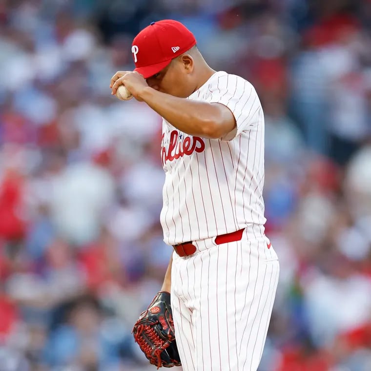 Phillies pitcher Ranger Suarez pulls down his cap before throwing a pitch against the St. Louis Cardinals on June 1.