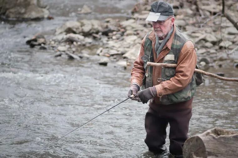 John Jones , of Springfield, Delaware County, gets into the spirit of spring, trout fishing in Ridley Creek at Ridley Creek State Park.