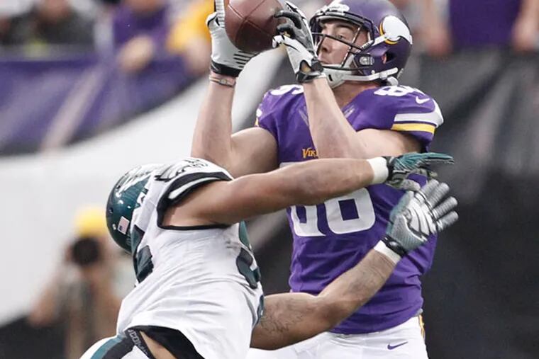The Vikings' Case Ford makes a reception despite the efforts of eagles
Mychal Kendricks. (Ron Cortes/Staff Photographer)