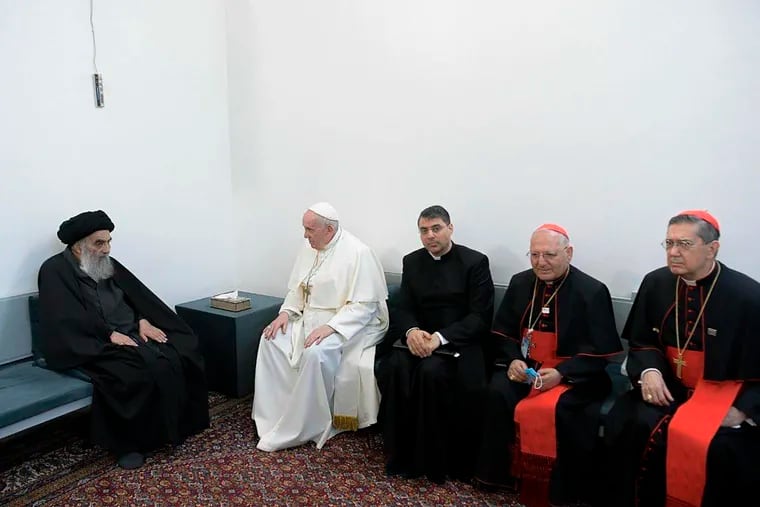 Shiite Muslim leader, Grand Ayatollah Ali al-Sistan, left,  and Pope Francis, 2nd left, and Christian Priests  in Najaf, Iraq, on March 6.